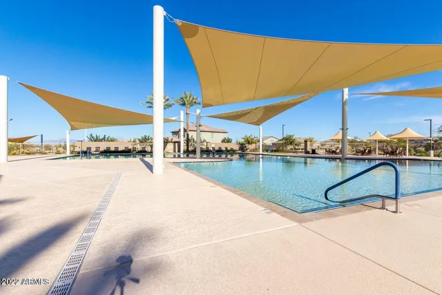 a living room with furniture and a large window with view of living room