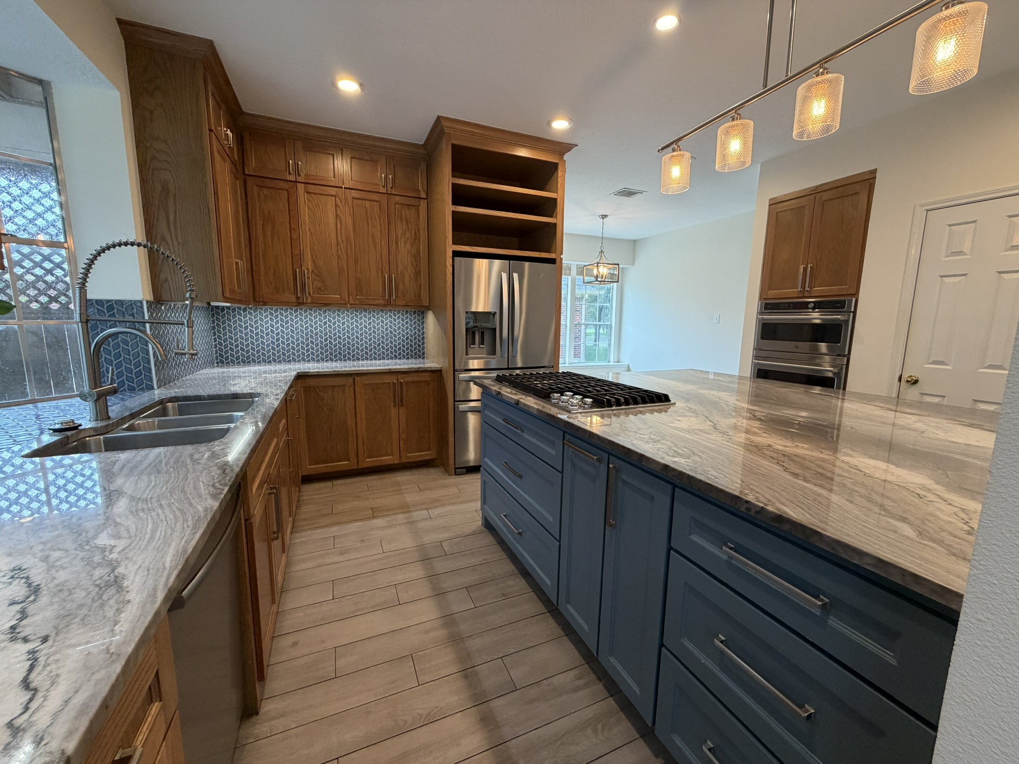 13810 Inland Spring Court Houston, TX 77059 - Photo 14 of 27 Gas cooktop on the island. Plenty of cabinet storage