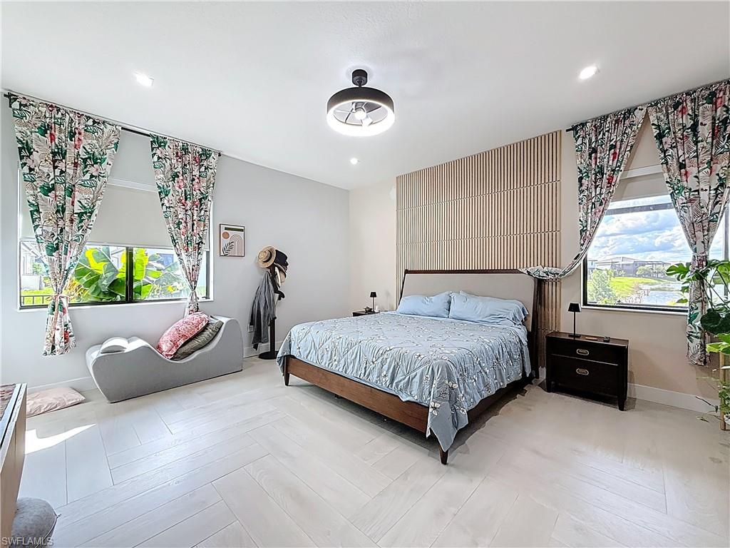 5277 Lamone Ln Avenue Immokalee, FL 34142 - Photo 17 of 27 a bedroom with a bed and window