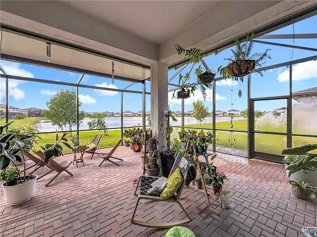 a view of a chairs and table in a patio