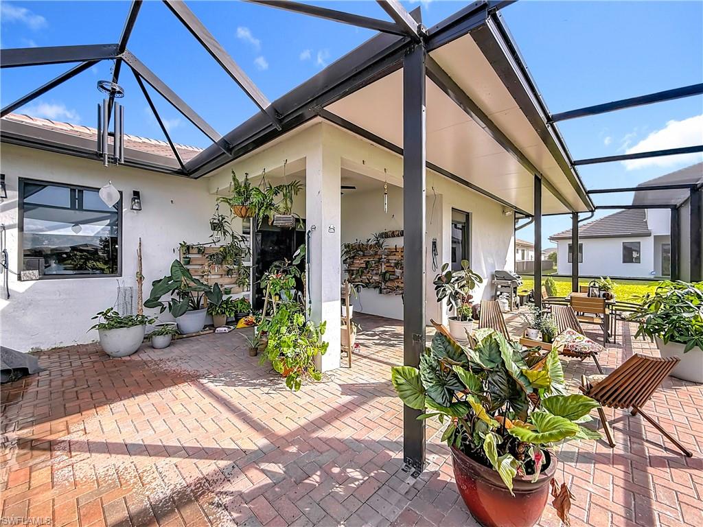 5277 Lamone Ln Avenue Immokalee, FL 34142 - Photo 24 of 27 a view of a chairs and table in a patio