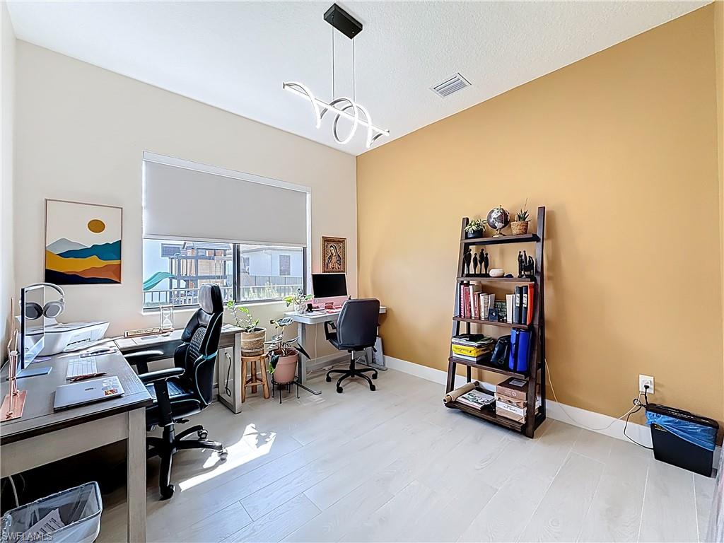 5277 Lamone Ln Avenue Immokalee, FL 34142 - Photo 10 of 27 a view of a workspace with furniture and a window