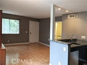 a kitchen with a sink and a stove