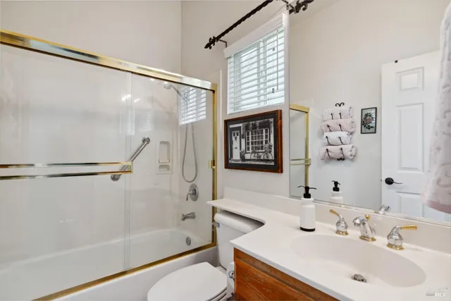 a view of living room filled with furniture and a window