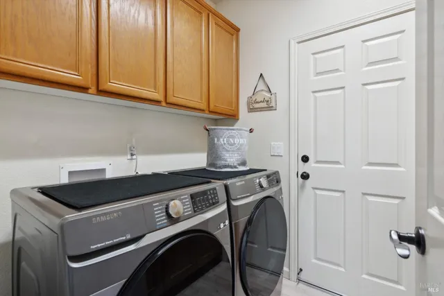 a view of a patio with couches chair and potted plants
