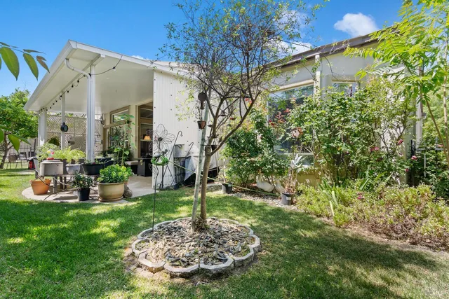 a outdoor living space with furniture and garden view