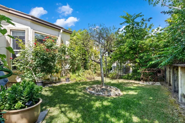 a living room with furniture fireplace and a large window
