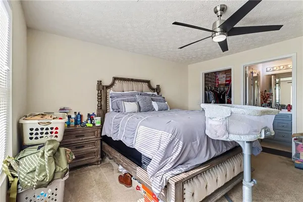 a bedroom with a bed furniture and a window