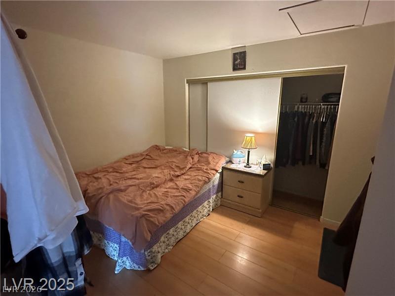 1830 North Pecos Road, Unit 230 Las Vegas, NV 89115 - Photo 13 of 16 Well-lit sleeping quarters with rich hardwood flooring and convenient closet access.