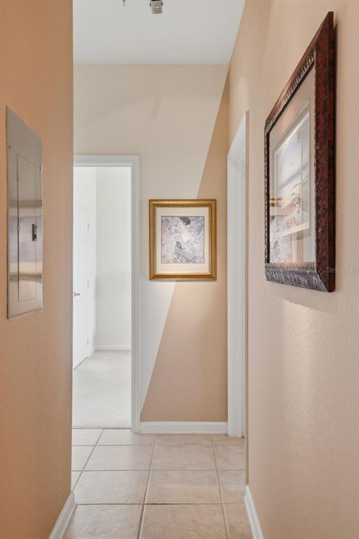 13560 Turtle Marsh Loop, Unit 336 Orlando, FL 32837 - Photo 12 of 38 a view of a hallway with paintings on the wall