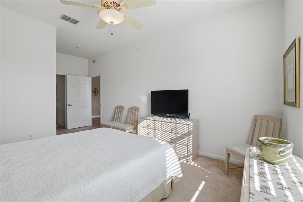13560 Turtle Marsh Loop, Unit 336 Orlando, FL 32837 - Photo 15 of 38 a bedroom with a bed and a television