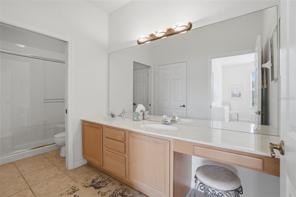 13560 Turtle Marsh Loop, Unit 336 Orlando, FL 32837 - Photo 17 of 38 a bathroom with a sink a toilet and shower
