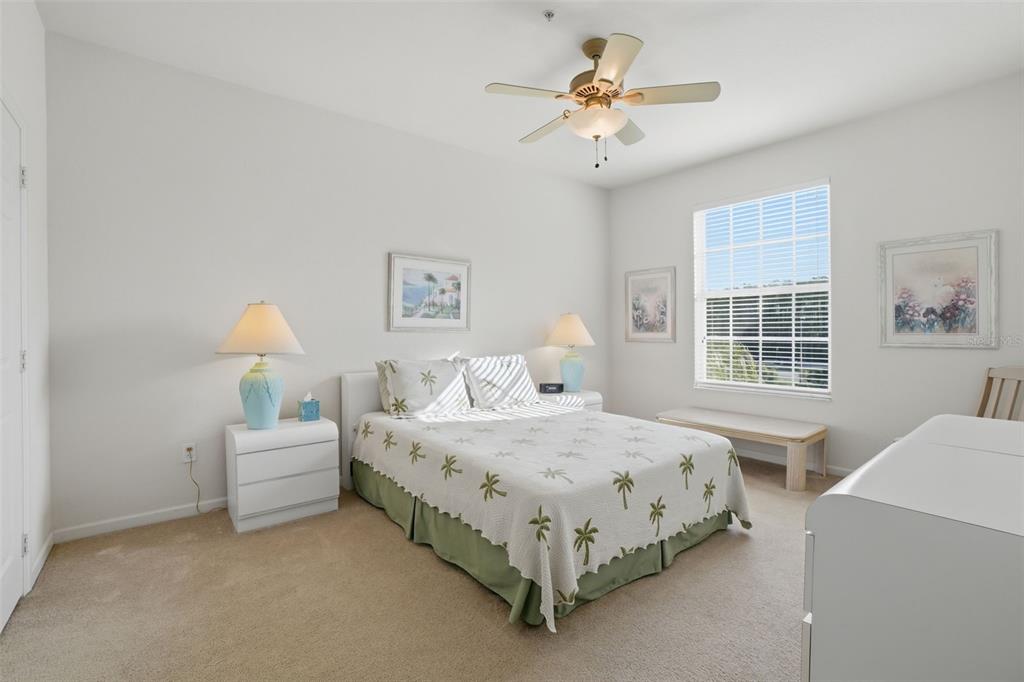 13560 Turtle Marsh Loop, Unit 336 Orlando, FL 32837 - Photo 19 of 38 a bedroom with a bed couch and window
