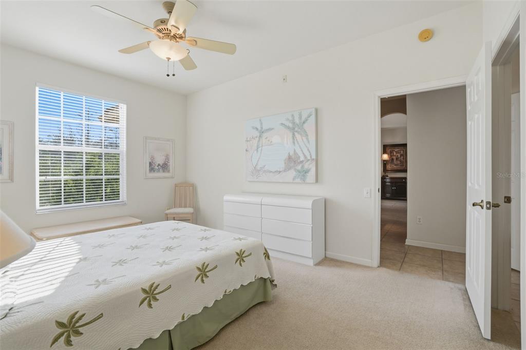 13560 Turtle Marsh Loop, Unit 336 Orlando, FL 32837 - Photo 20 of 38 a bedroom with a bed and a window
