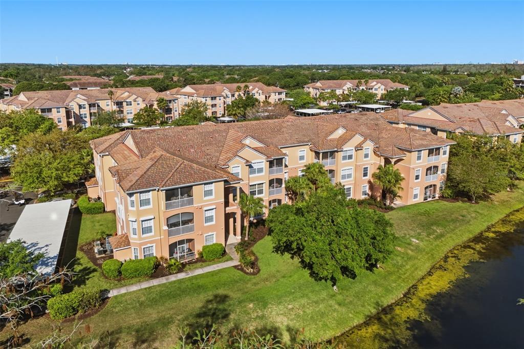 13560 Turtle Marsh Loop, Unit 336 Orlando, FL 32837 - Photo 32 of 38 an aerial view of residential houses with outdoor space and river