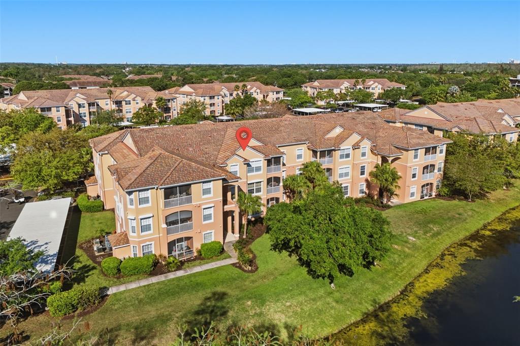 13560 Turtle Marsh Loop, Unit 336 Orlando, FL 32837 - Photo 33 of 38 an aerial view of residential houses with outdoor space and river