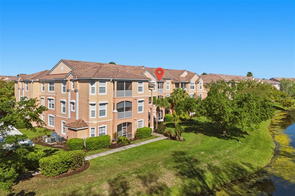13560 Turtle Marsh Loop, Unit 336 Orlando, FL 32837 - Photo 36 of 38 a front view of a building with a garden