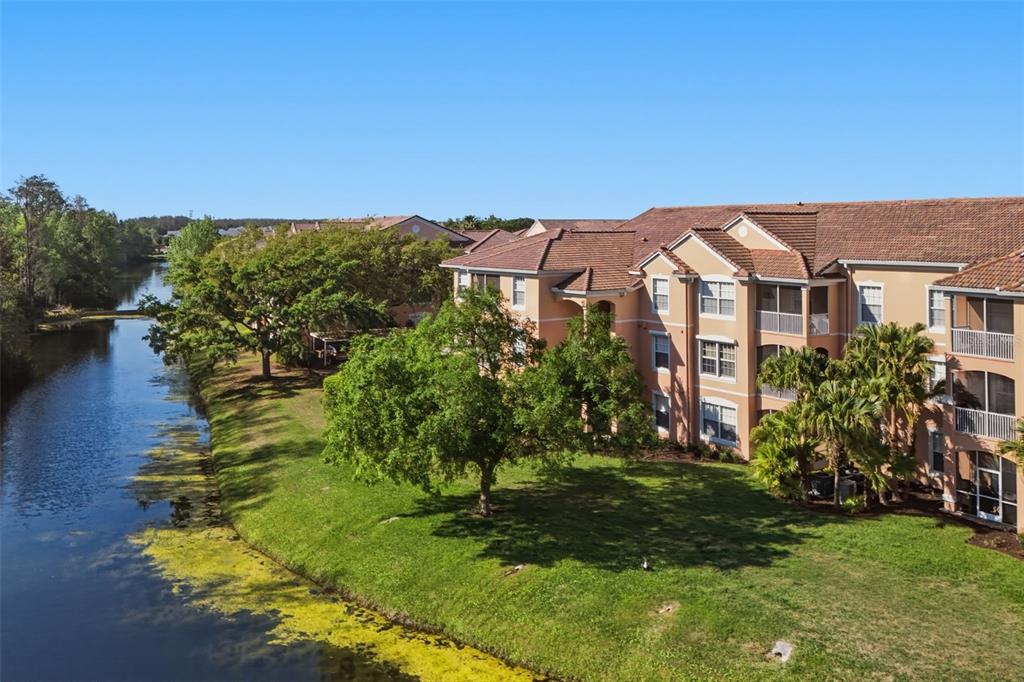 13560 Turtle Marsh Loop, Unit 336 Orlando, FL 32837 - Photo 38 of 38 a front view of a house with a yard