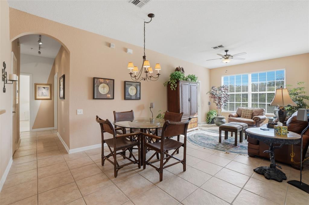 13560 Turtle Marsh Loop, Unit 336 Orlando, FL 32837 - Photo 5 of 38 a view of a dining room with furniture and windows
