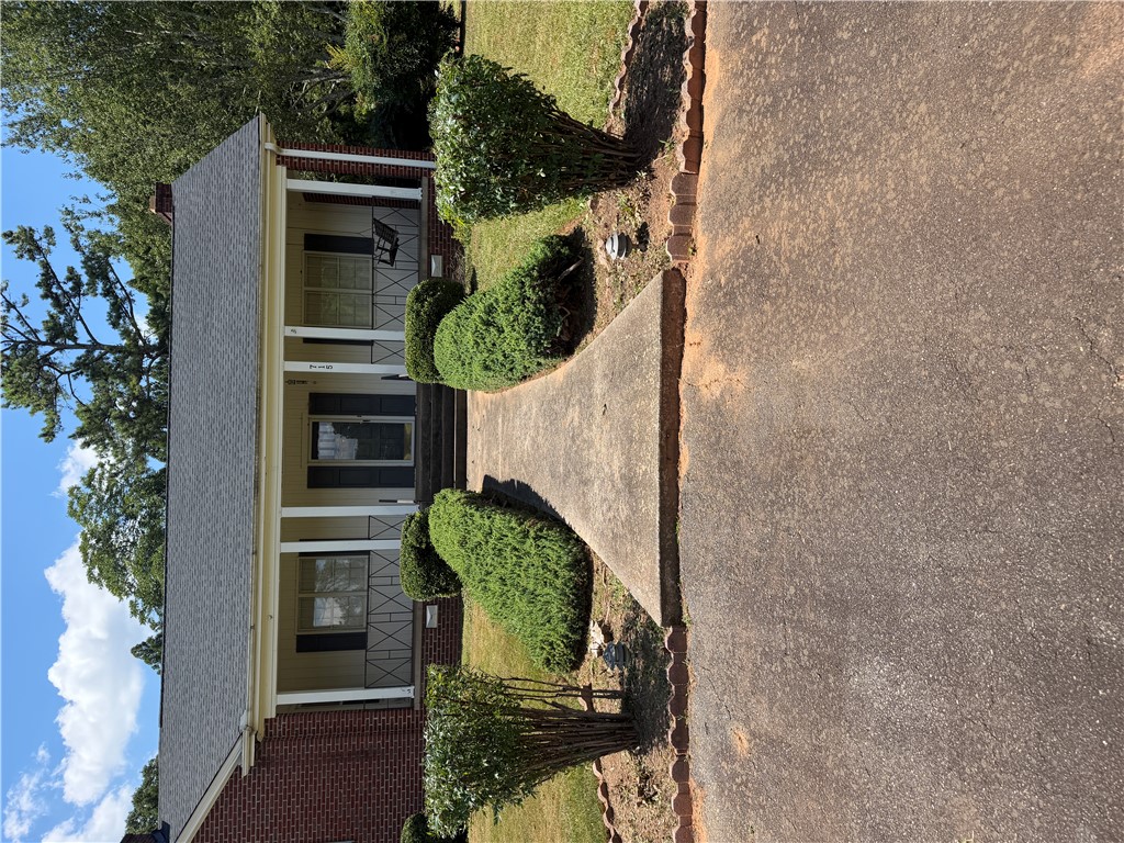 715 Concord Road Anderson, SC 29621 - Photo 2 of 24 A welcoming front porch and manicured shrubs creates inviting curb appeal.