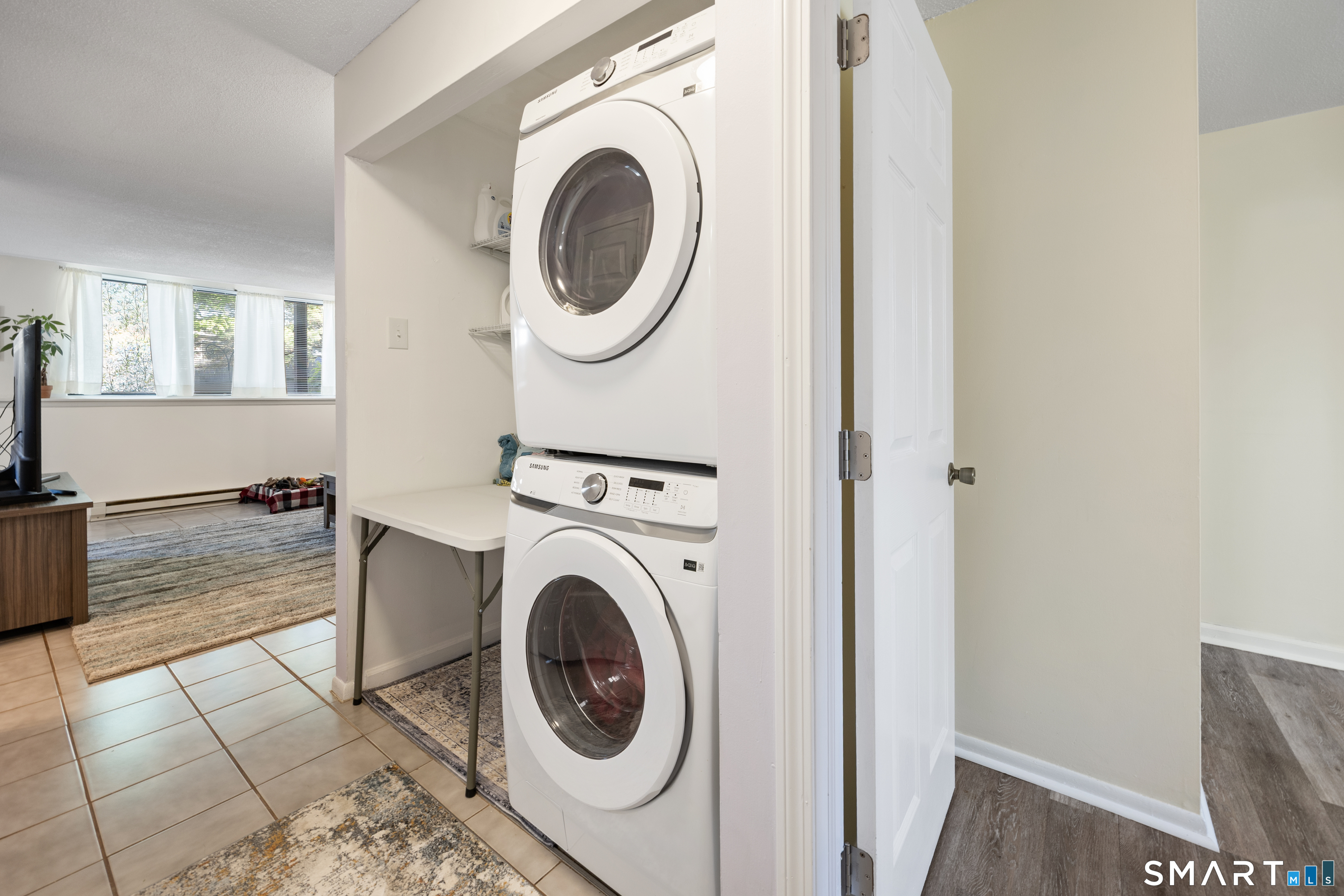 560 Yale Avenue, Unit 82 Meriden, CT 06450 - Photo 13 of 22 a view of a hallway with washer and dryer