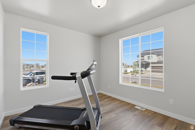 1353 Mapleton Hts Court Mapleton, UT 84664 - Photo 14 of 50 This can be an office, living room, workout room featuring light wood-type flooring and healthy amount of natural light. Right off of the entry.