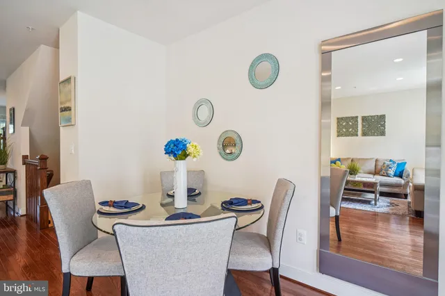 a bedroom with a large bed and a flat tv screen