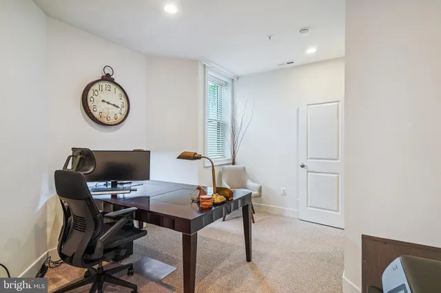 a view of backyard with swimming pool and green space