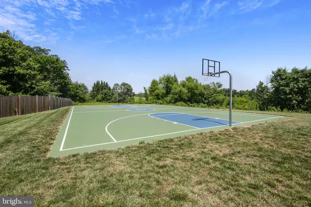 a view of a building with cars parked