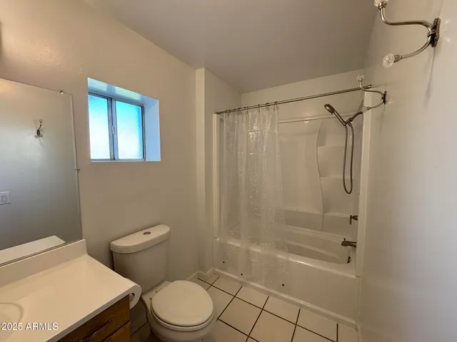 a kitchen with granite countertop a sink a stove and cabinets