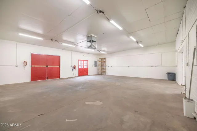 an empty room with a empty space and windows