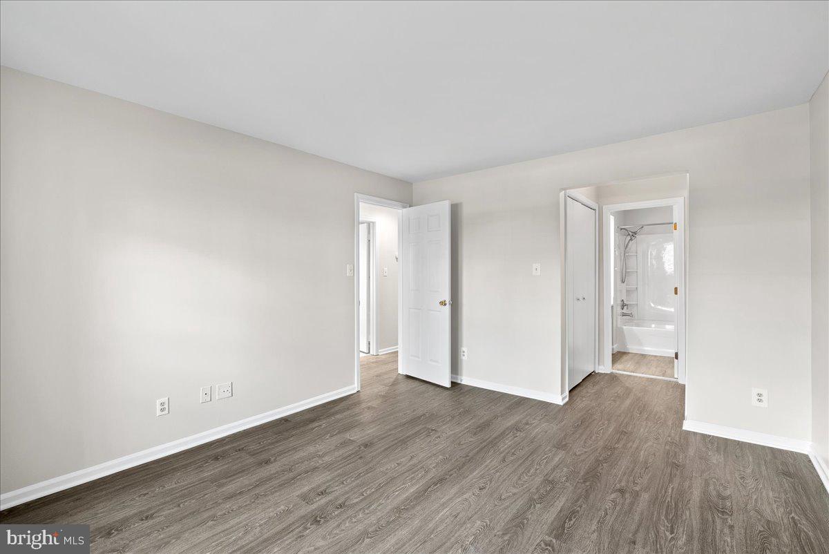 12942 A Grays Pointe Road, Unit 12942A Fairfax, VA 22033 - Photo 16 of 22 a view of an empty room and wooden floor