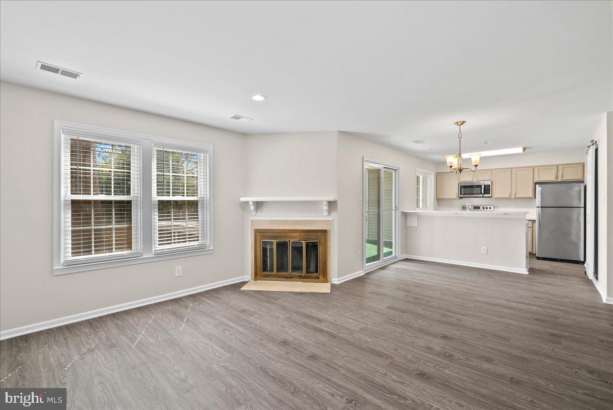 12942 A Grays Pointe Road, Unit 12942A Fairfax, VA 22033 - Photo 5 of 22 a view of a kitchen with a sink cabinets and a fireplace
