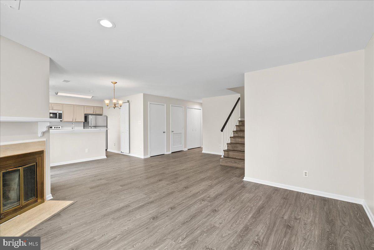 12942 A Grays Pointe Road, Unit 12942A Fairfax, VA 22033 - Photo 6 of 22 a view of a kitchen with wooden floor and a sink