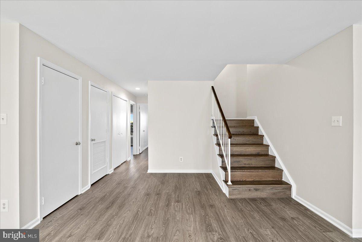 12942 A Grays Pointe Road, Unit 12942A Fairfax, VA 22033 - Photo 10 of 22 a view of a room with wooden floor and stairs