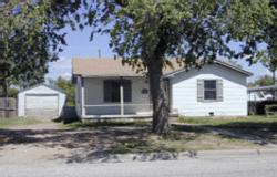 4621 Parker Street Amarillo, TX 79110 - Photo 1 of 1 a front view of a house with garden