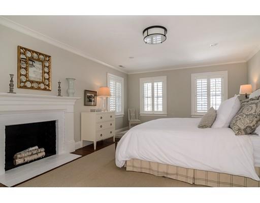 25 Kenilworth Road Wellesley, MA 02482 - Photo 16 of 28 a bedroom with a bed and a fireplace