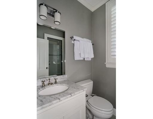 25 Kenilworth Road Wellesley, MA 02482 - Photo 17 of 28 a bathroom with a toilet sink vanity and mirror