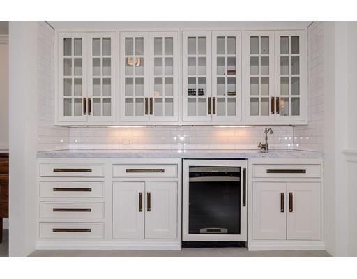 25 Kenilworth Road Wellesley, MA 02482 - Photo 25 of 28 a stove top oven sitting inside of a kitchen