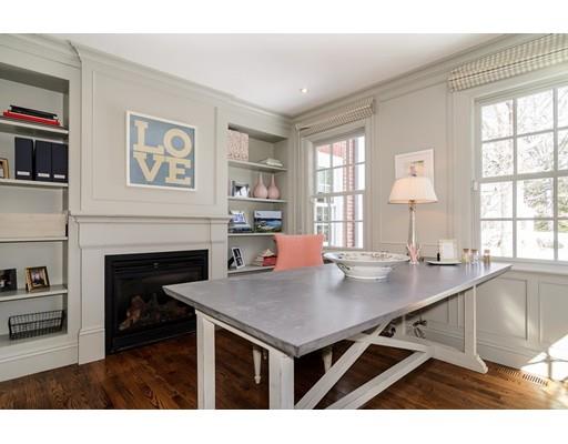 25 Kenilworth Road Wellesley, MA 02482 - Photo 9 of 28 a kitchen with a table chairs and a fireplace