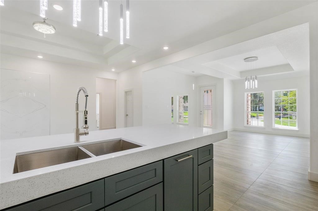 2291 Riverside Drive West Columbia, TX 77486 - Photo 26 of 50 a kitchen with a sink and chandelier