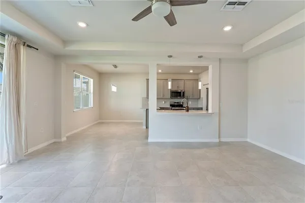 a kitchen with cabinets and window