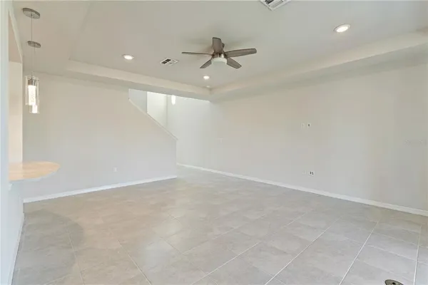 a large kitchen with a large counter top appliances and cabinets