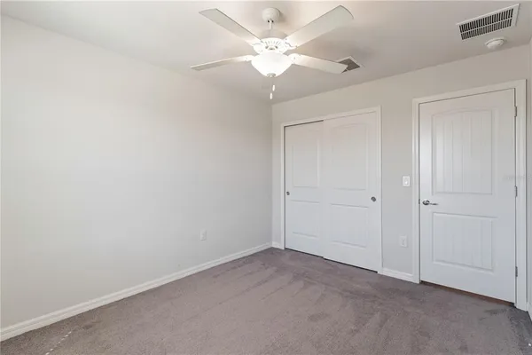 a view of a living room and floor to ceiling window
