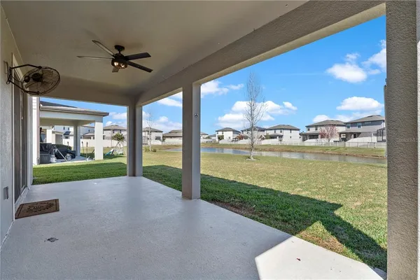 a view of a swimming pool with an outdoor space and seating area