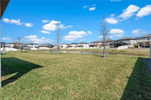 a view of house with yard