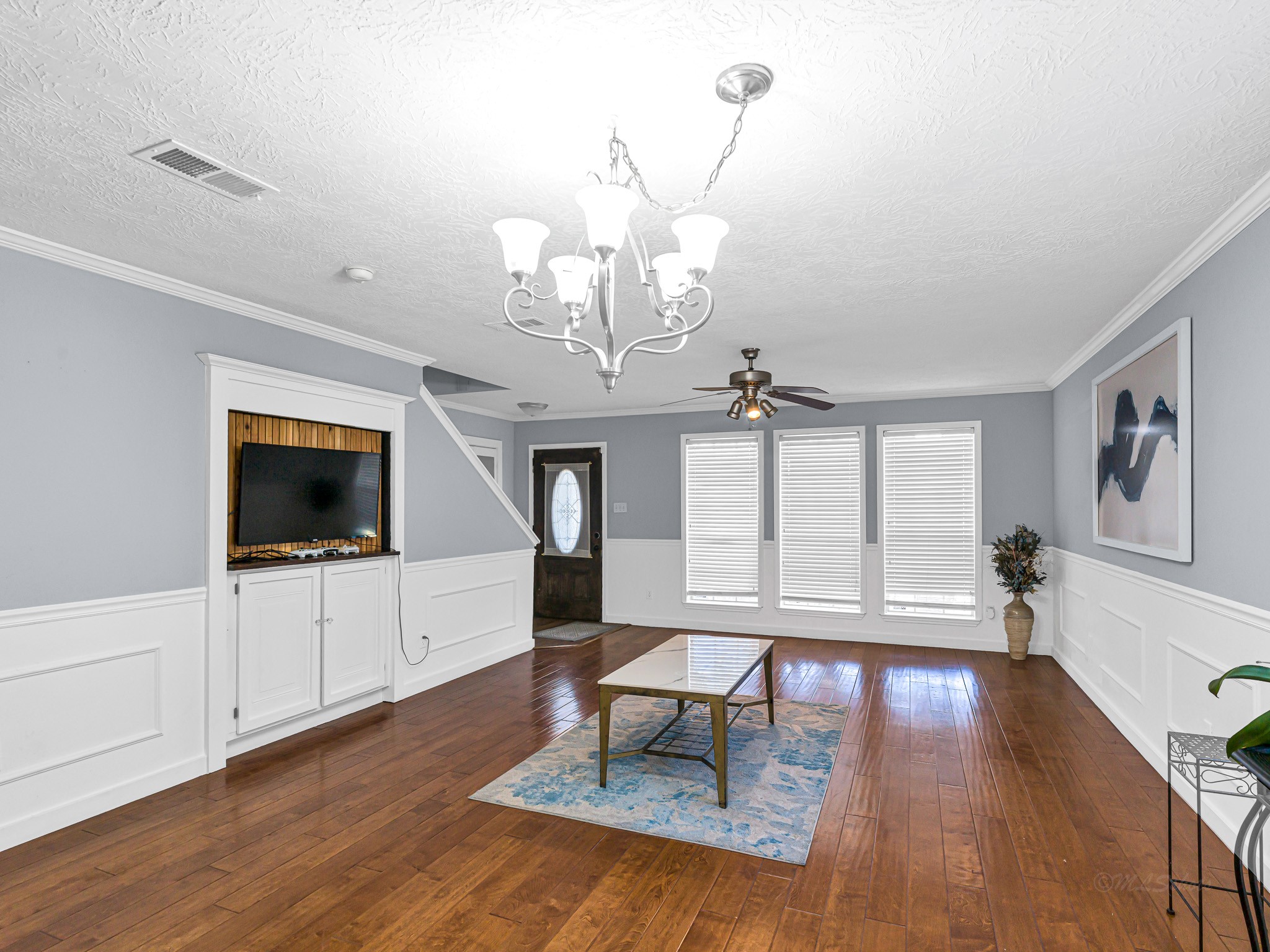 6822 Eagle Ridge Drive Katy, TX 77449 - Photo 11 of 36 a living room with furniture and a flat screen tv