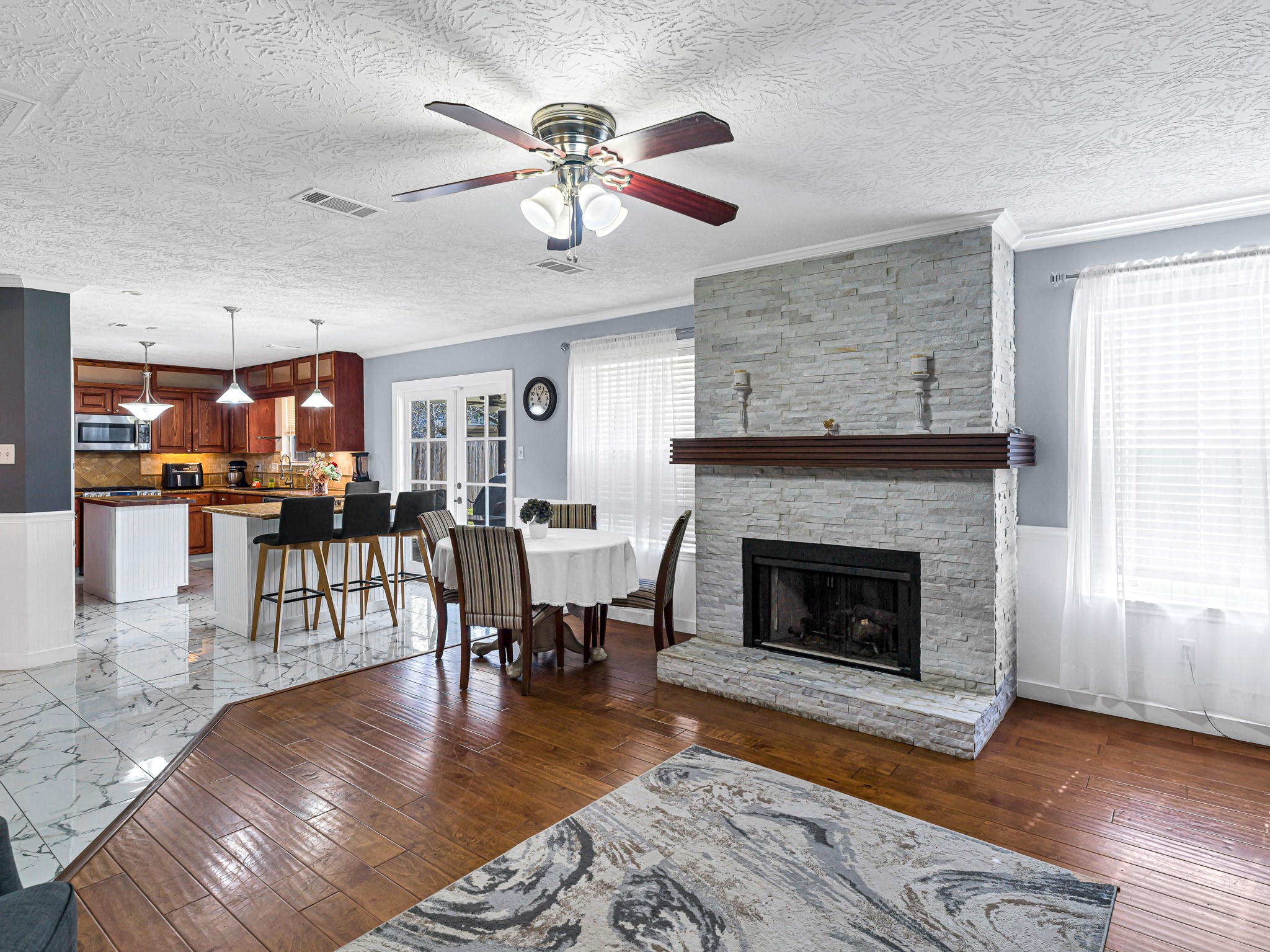 6822 Eagle Ridge Drive Katy, TX 77449 - Photo 15 of 36 a living room with furniture and a fireplace