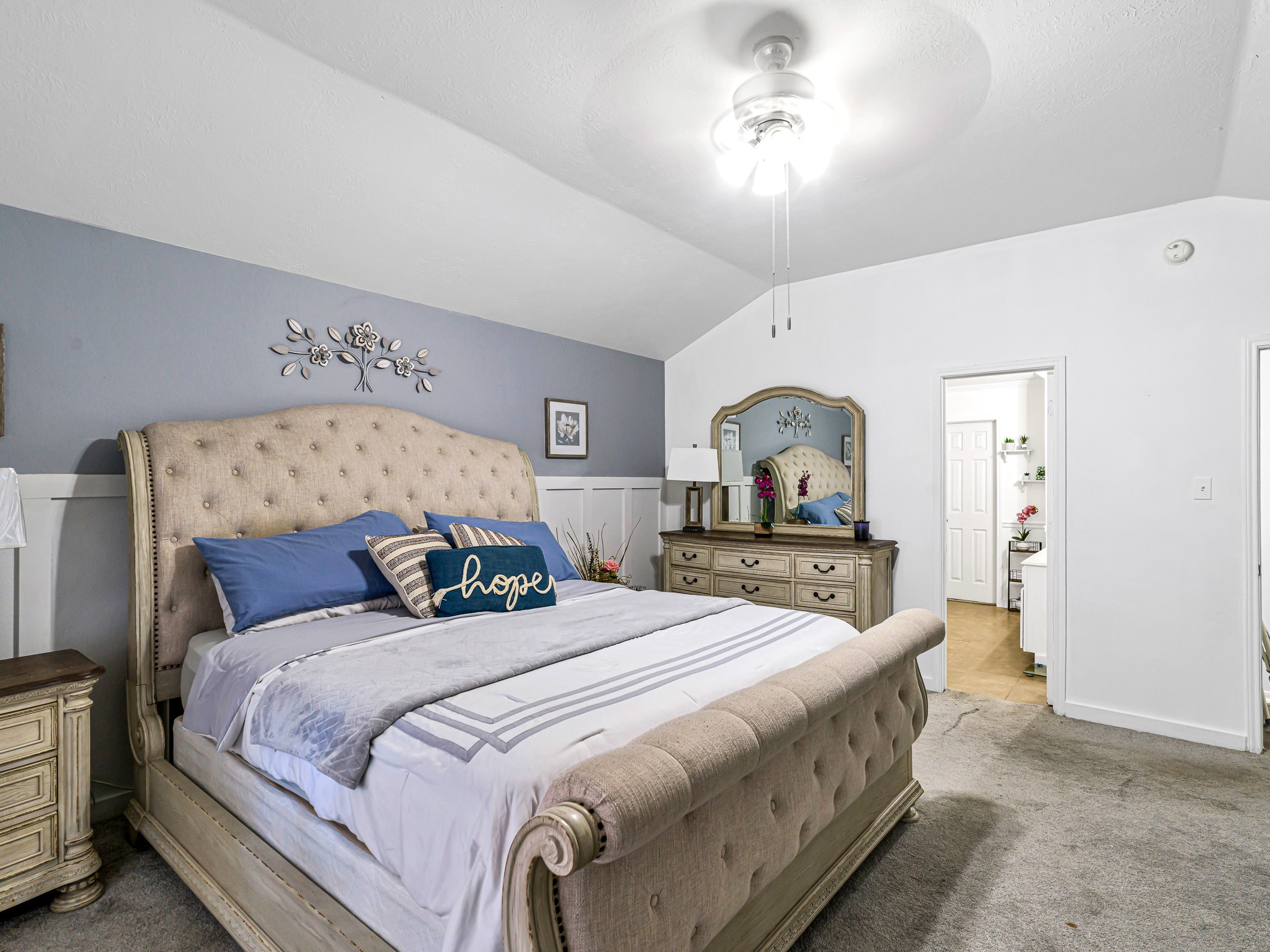 6822 Eagle Ridge Drive Katy, TX 77449 - Photo 22 of 36 a bedroom with bed and a chandelier