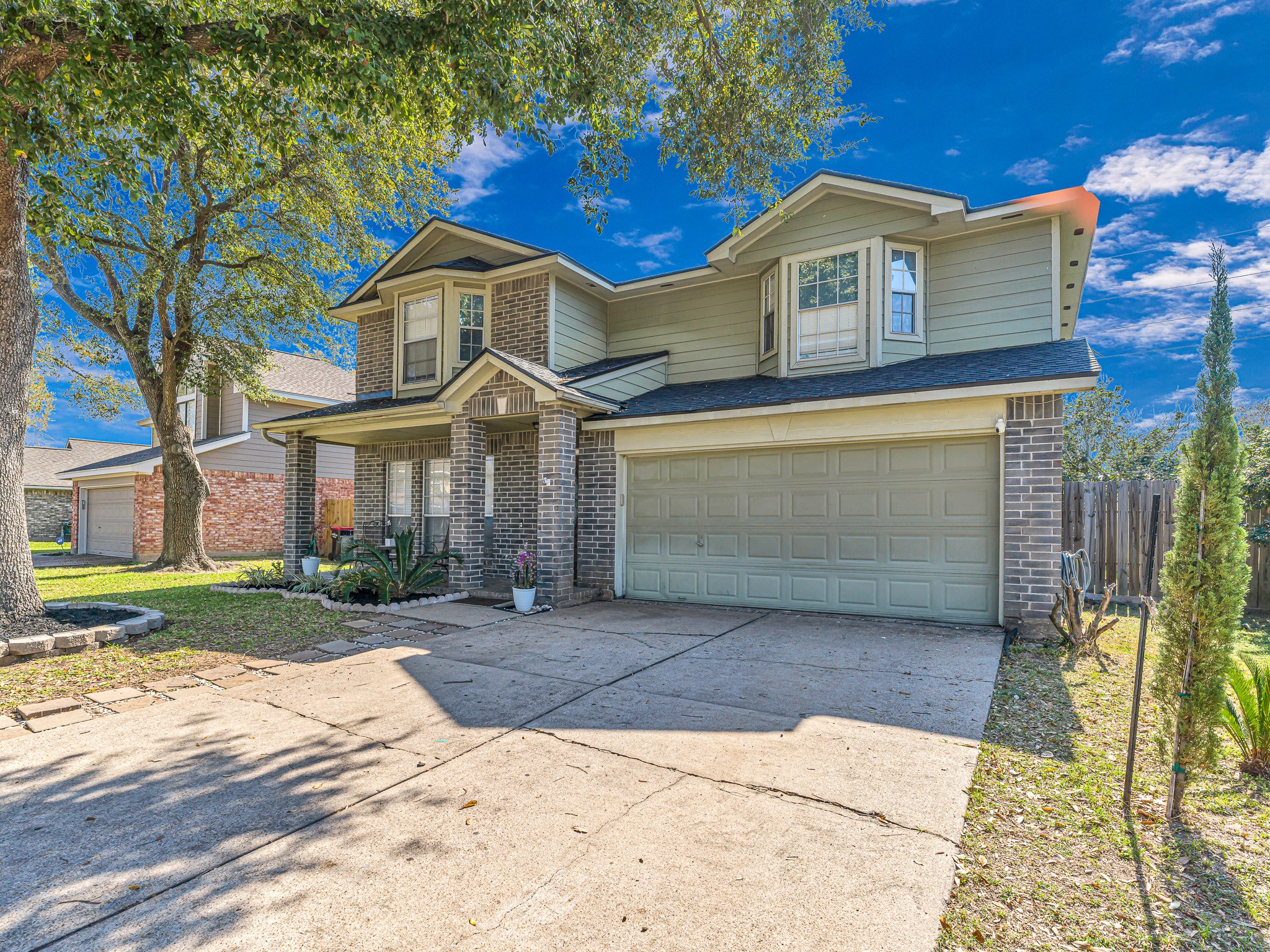 6822 Eagle Ridge Drive Katy, TX 77449 - Photo 3 of 36 a front view of a house with a yard and garage